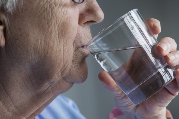 side view elderly woman drinking water 53876 22
